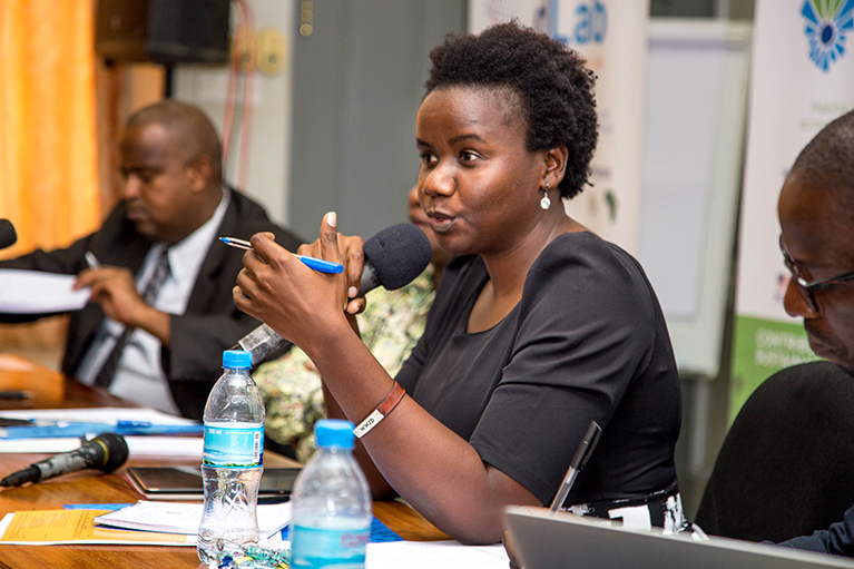 A Data Zetu participant speaking into a microphone at a meeting