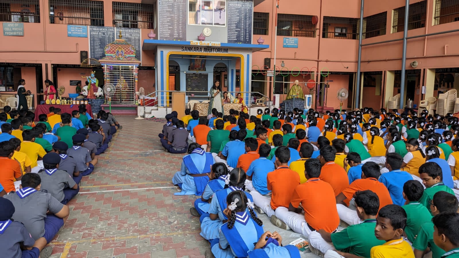 Youth leader teaching a lesson in front of a class of students