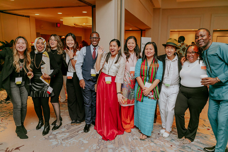 Group of participants standing and smiling