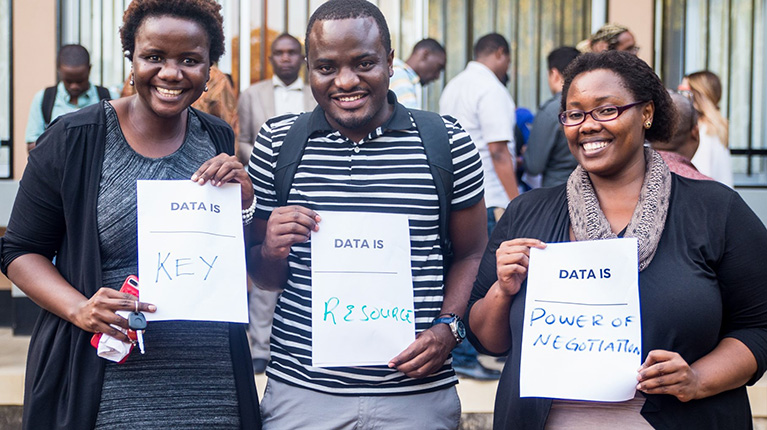 Participants holding sign that says Data