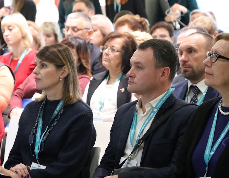 An Audience listens to a speaker