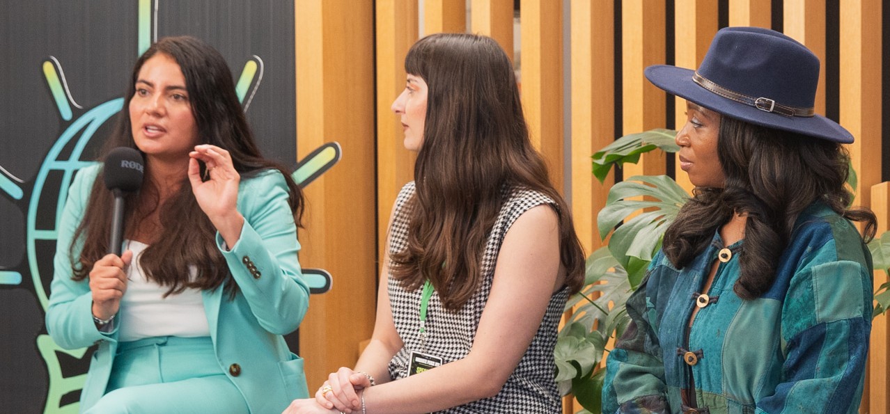 Three people sitting and talking