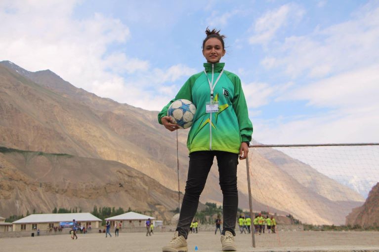 Karishma on soccer field with a ball