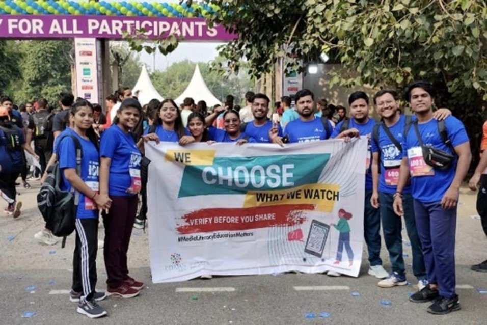 A group of people holding a banner