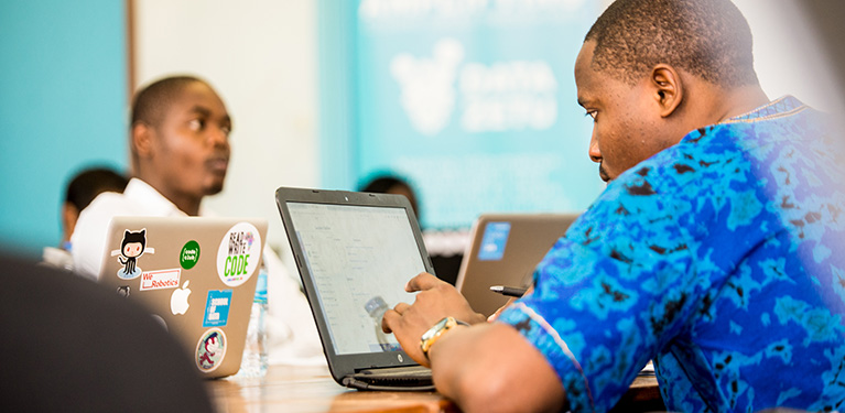 A person looking at a laptop in a training session.