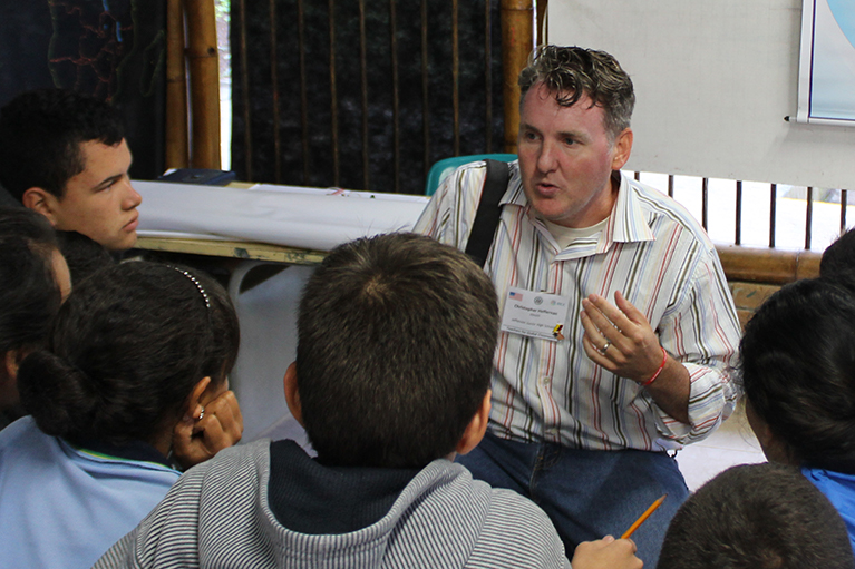 Photo of a U.S. teacher in a classroom abroad.