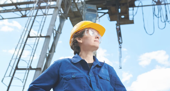 A person wearing a hard hat and goggles