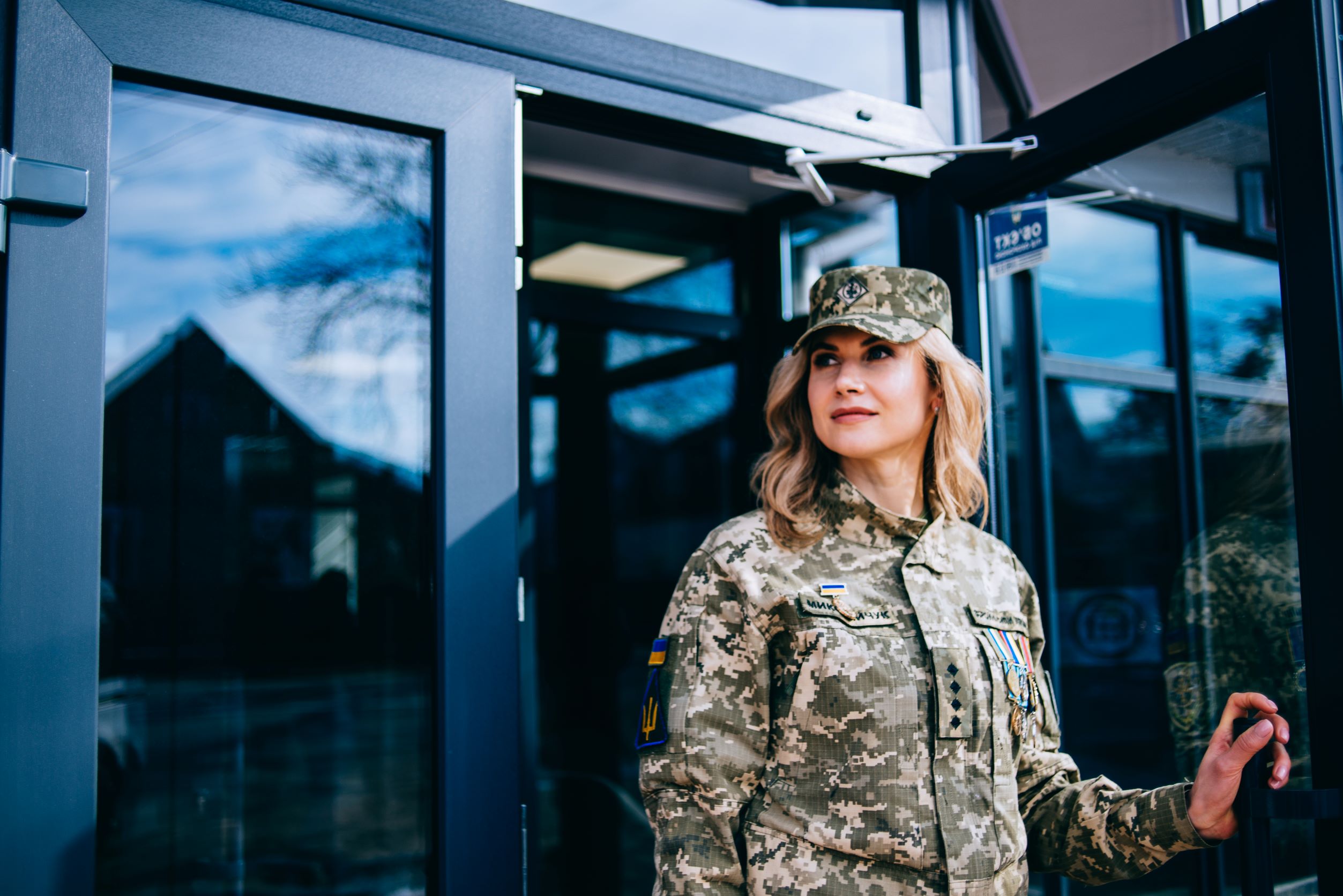 Photo of female veteran standing in a doorway.