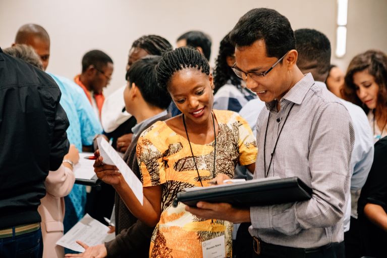 Two youth working on an assignment together