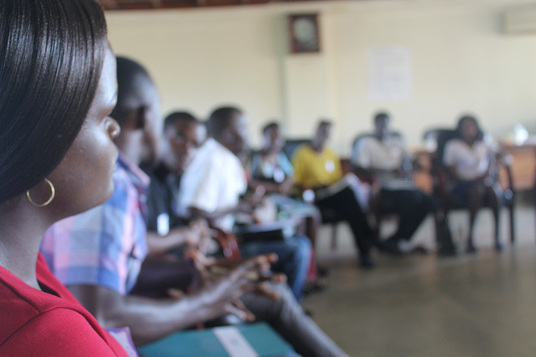 Photo of a circle of young people from a youth-led labor market assessment in Uganda.