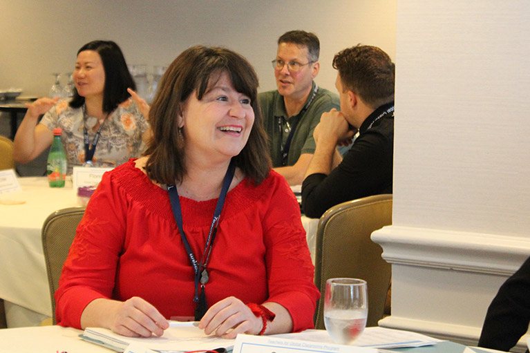 Participants having discussions in a conference room