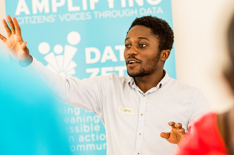 A leader talking to a group in Tanzania