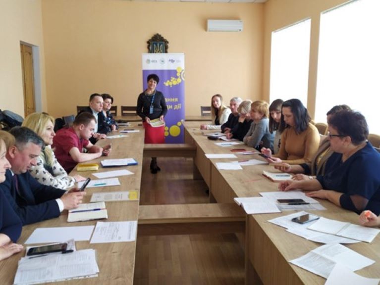 A group of people sitting at a table