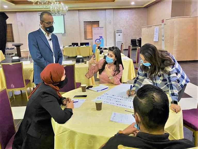 Journalists in Jordan sitting at a table during a training.