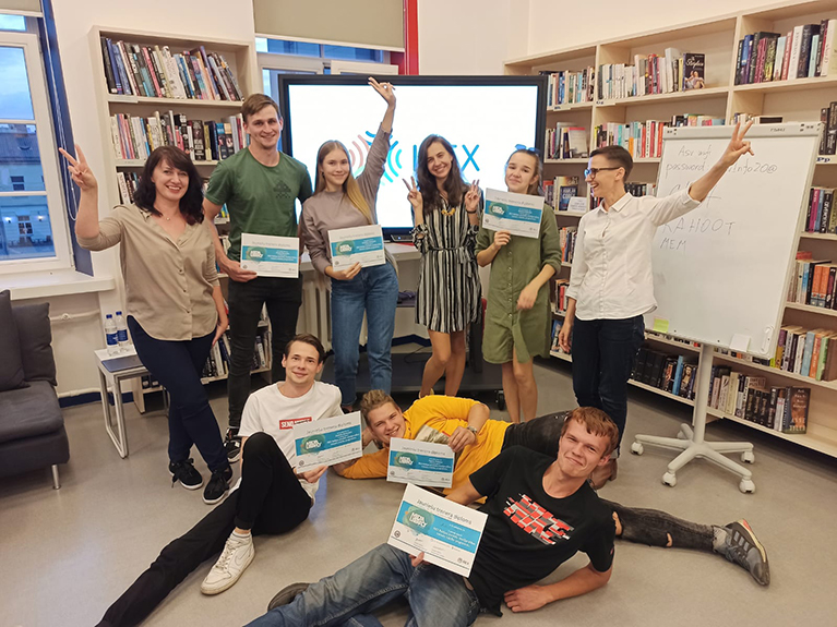 Youth trainers holding certificates.