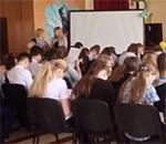 Students in a school auditorium in Ukraine