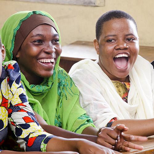 Two participants laughing during a workshop.