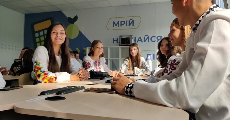 Group of young people sitting in a classroom 